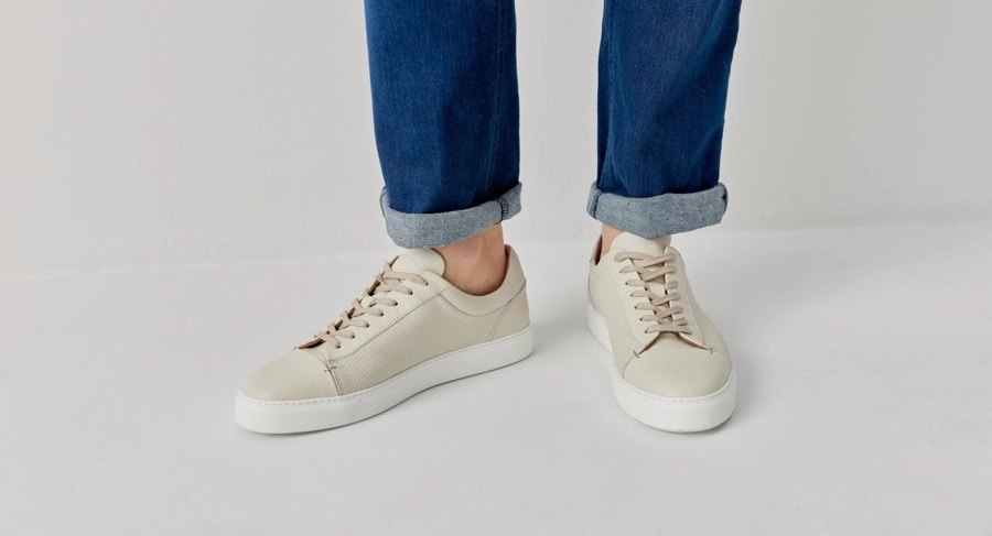 Model wearing LUCIAN minimalist bone leather trainers